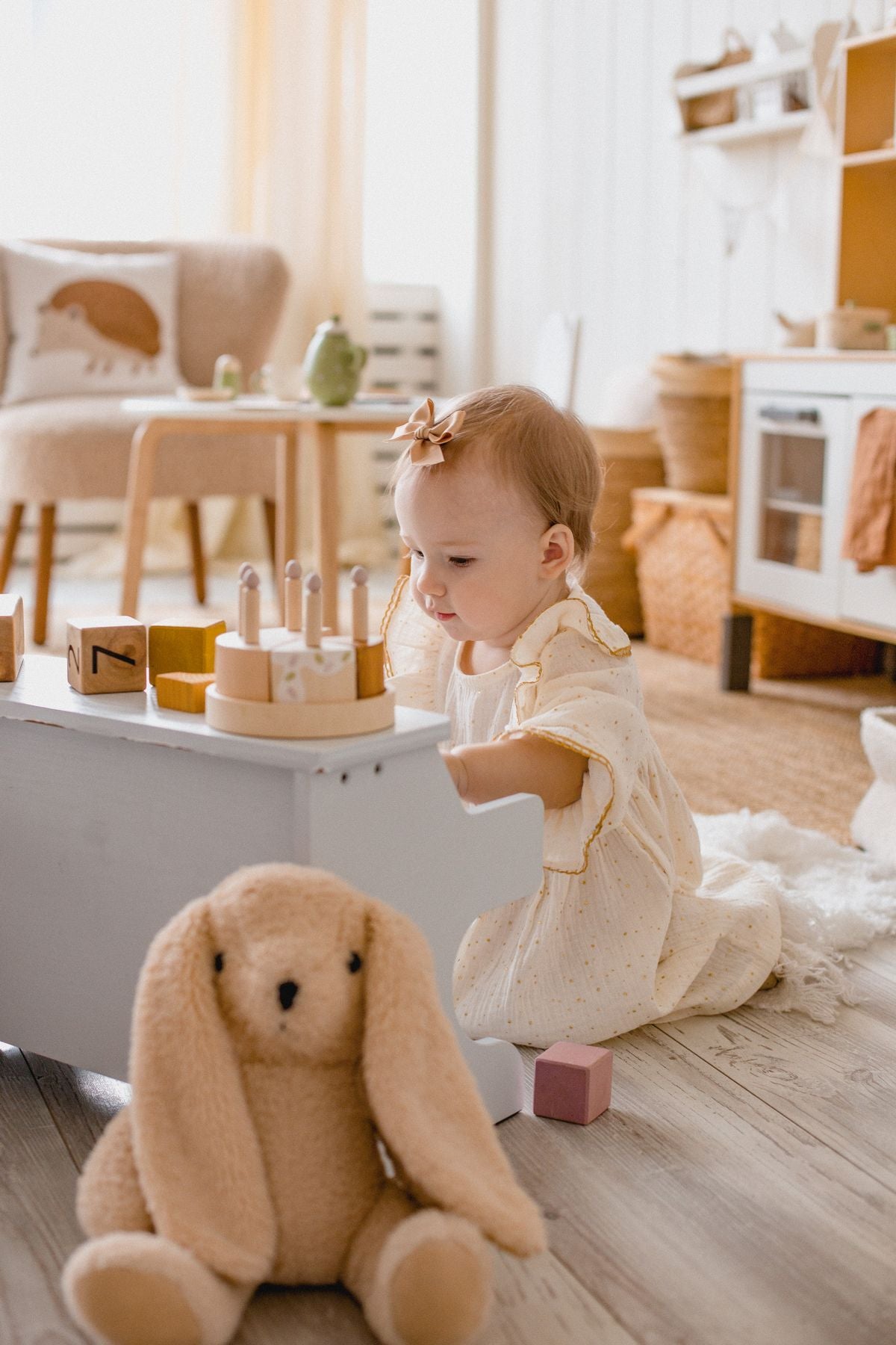 Young child playing a toy piano in their room