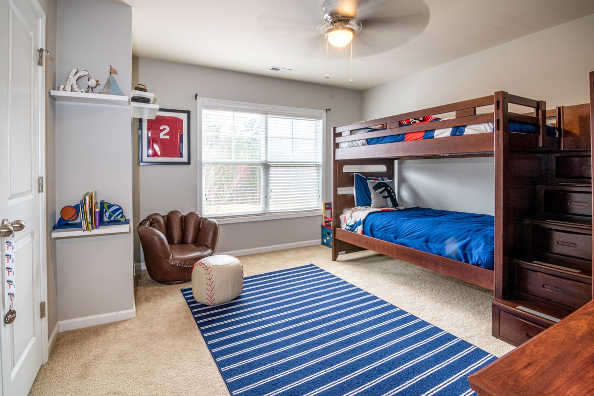 Kids room with picture ledges and wall shelves