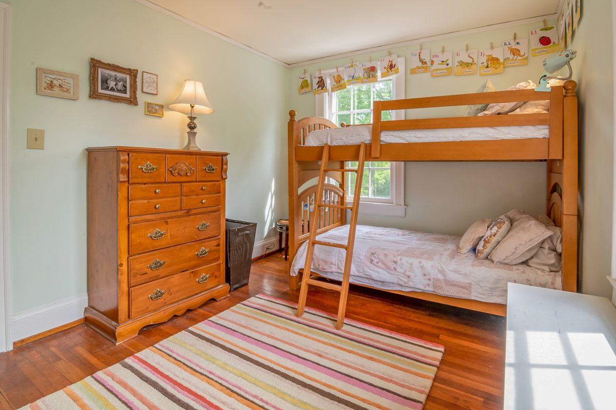 Brown wooden bunk bed in a kids room