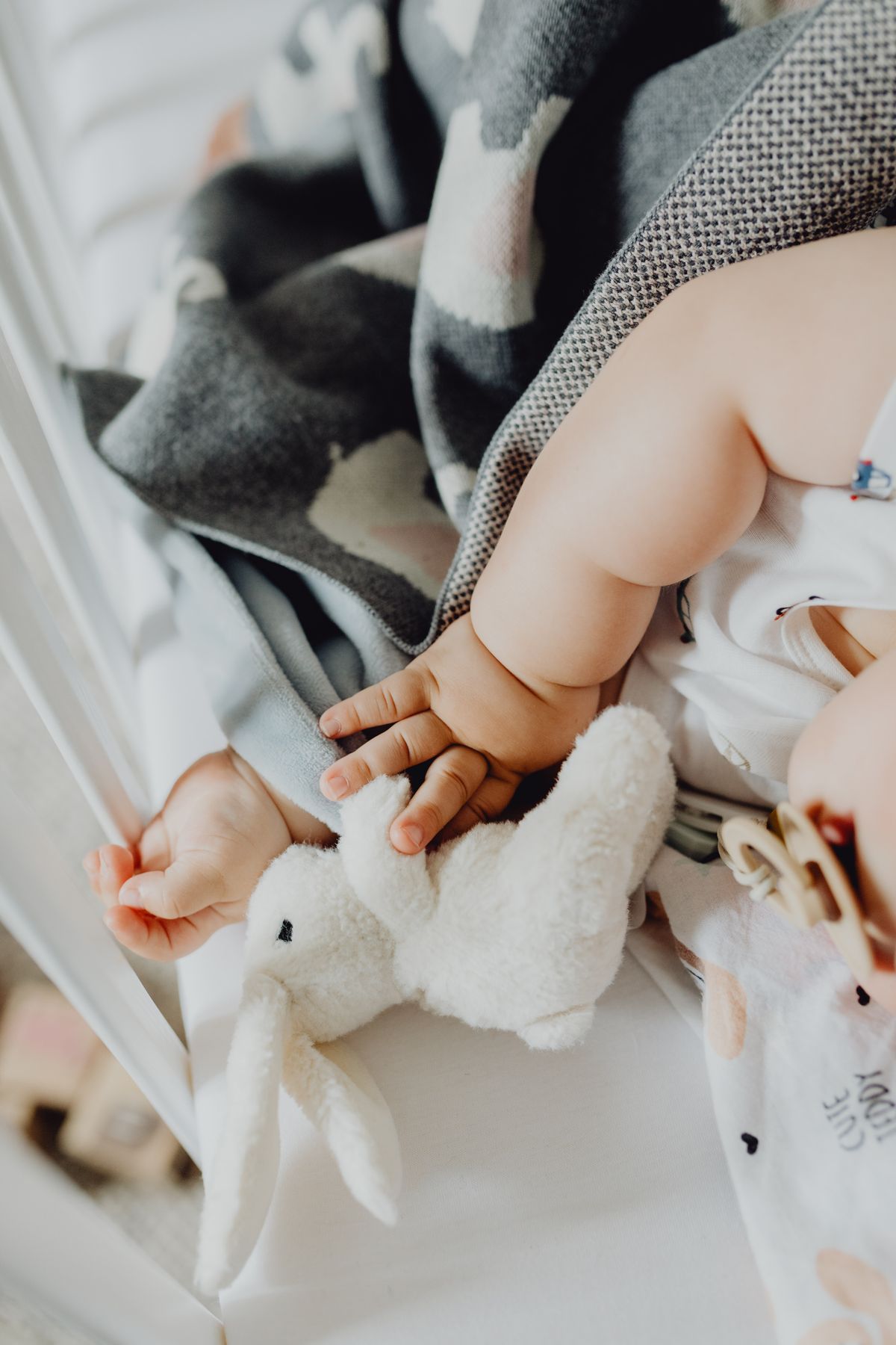 Baby lying down looking at a high-contrast toy