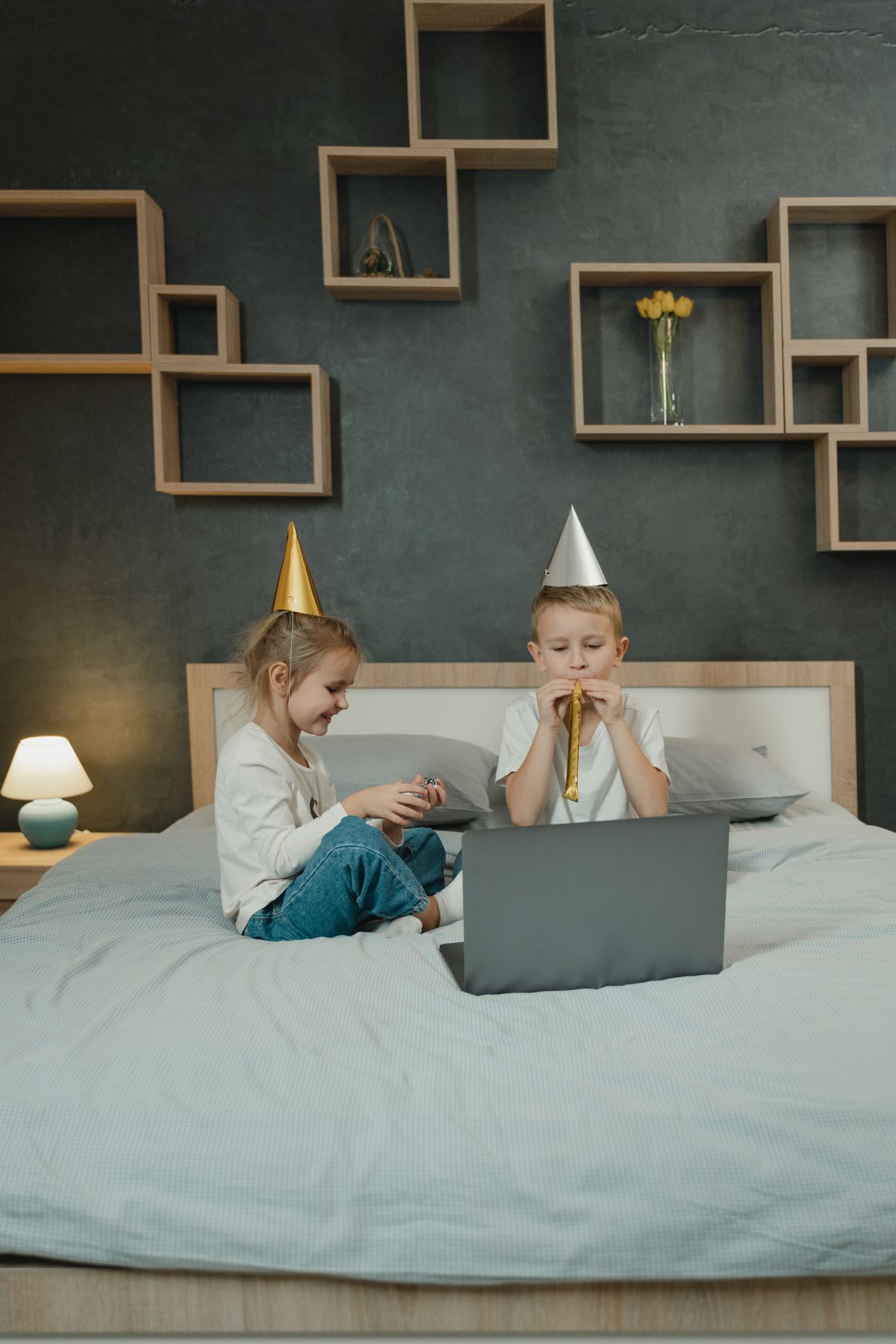 Kids in dress-up hats playing together