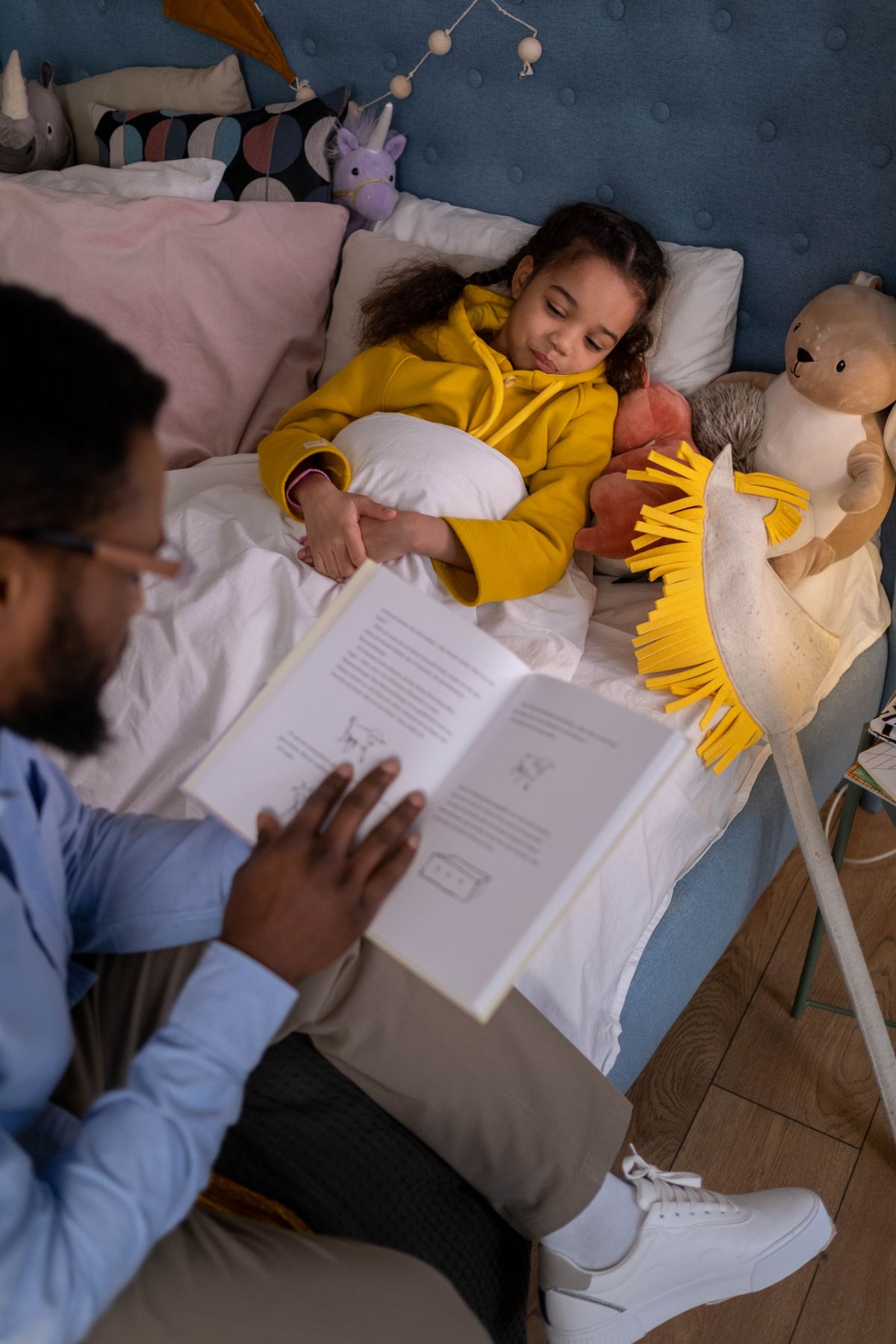 Parent reading a bedtime story to their child