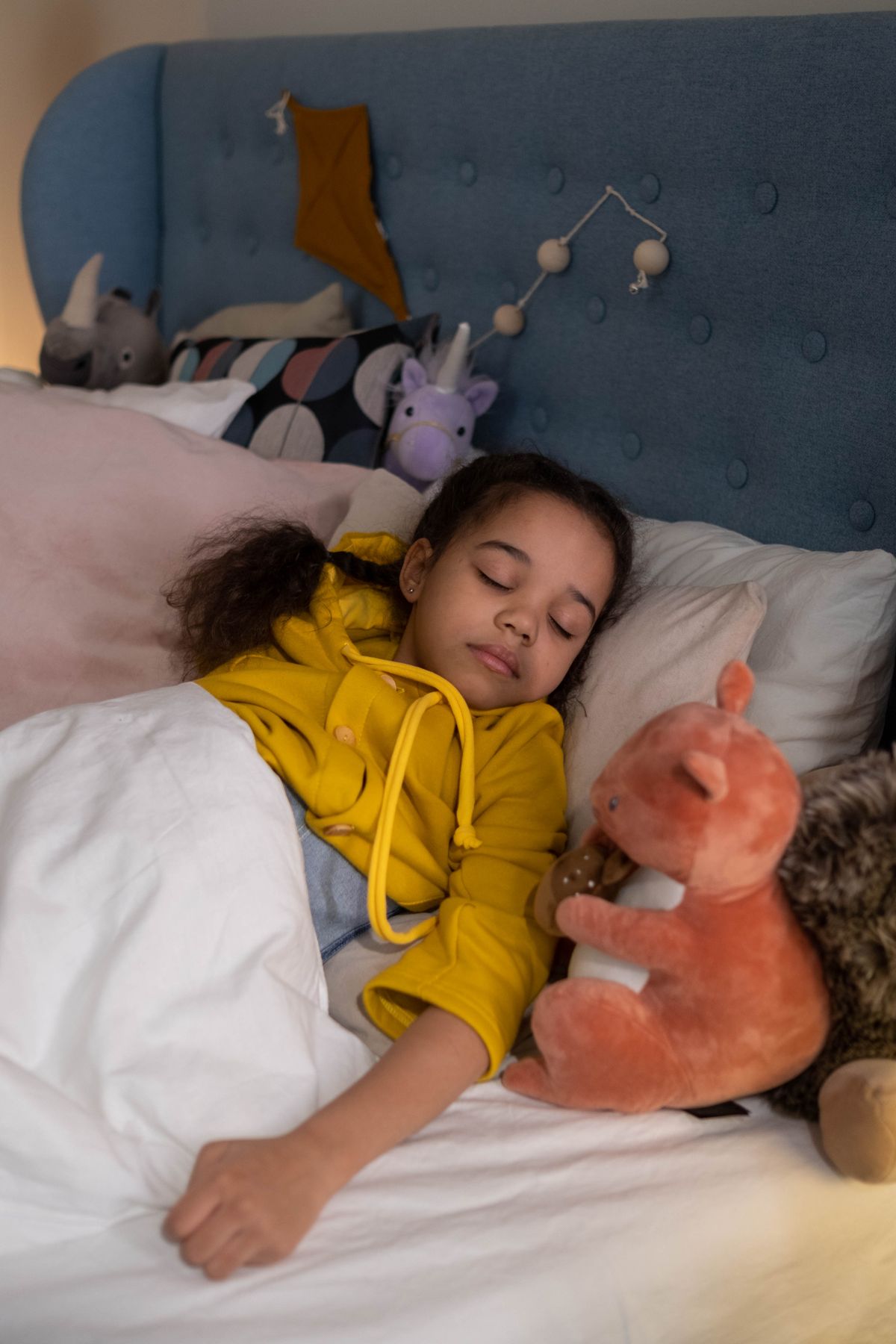 Child sleeping peacefully in a calm bedroom
