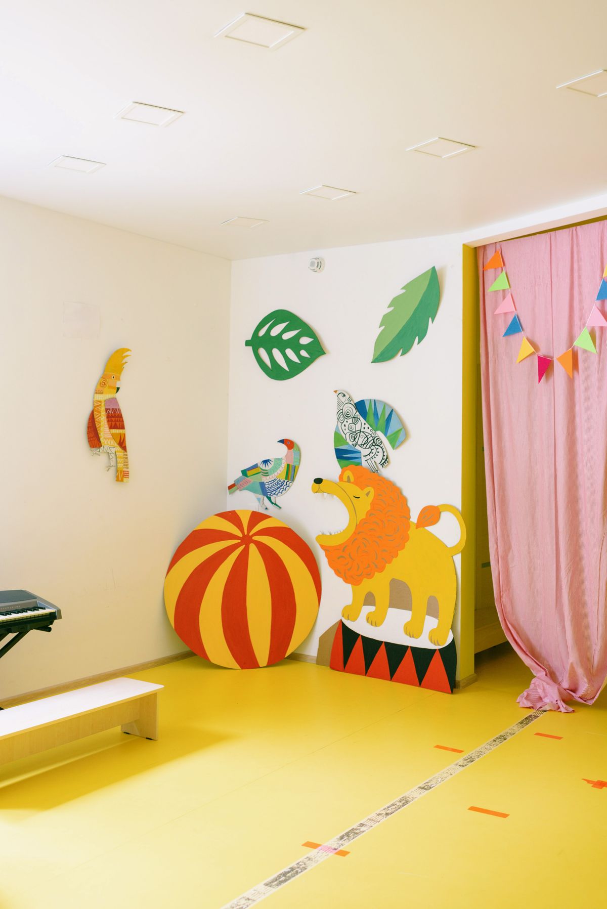 Framed kids artwork displayed on a wall