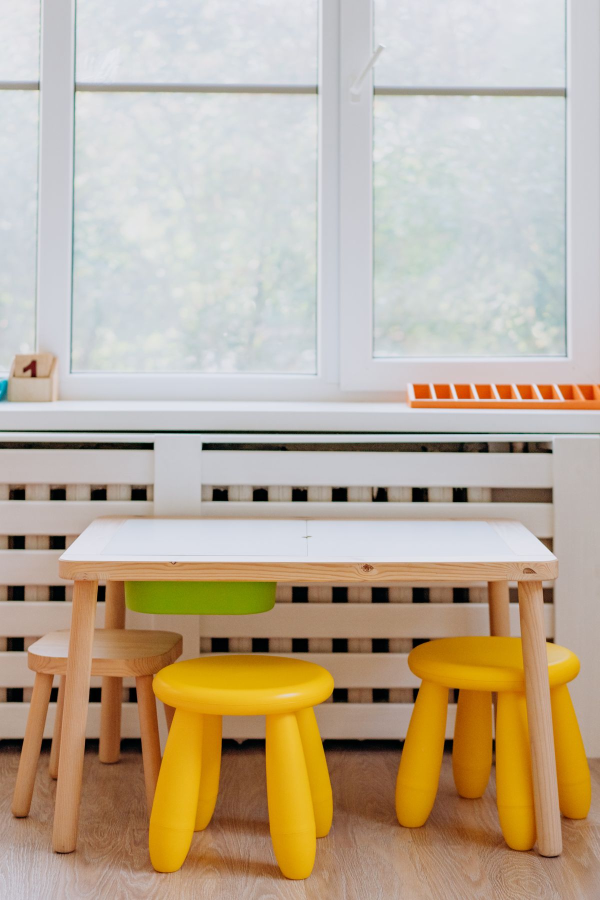 Low wooden wardrobe furniture in a kids room